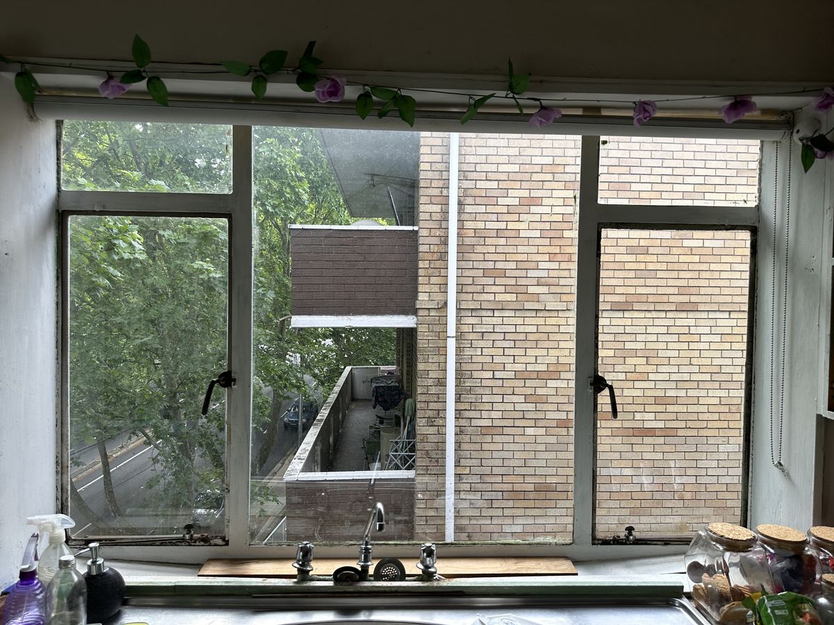 Older single glazed aluminium kitchen window in a Randwick unit